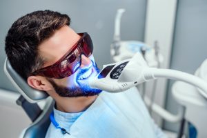 man getting dental treatments
